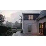 EcoFlow PowerOcean Single-Phase wall-mounted on an exterior wall at dusk