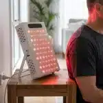 NeuroActive 300W red light therapy panel used for a shoulder session