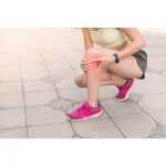 Runner holding a sore knee