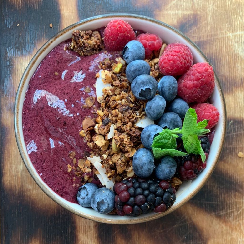 Acai bowl base with granola, berries and mint, blended thick in a Kuvings CB1000