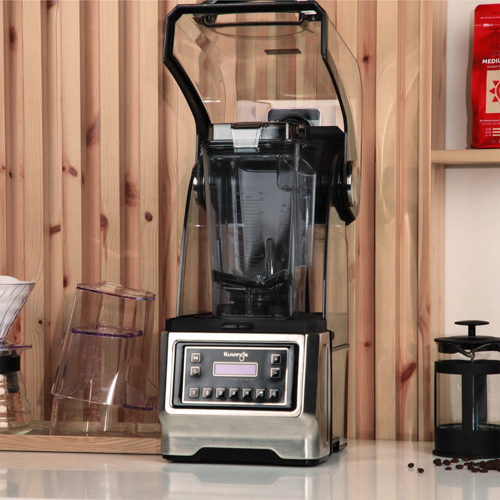 Kuvings CB1000 vacuum blender on a cafe counter