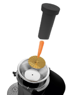 A whole carrot dropped into the 75 mm feed chute of the Zumex Multifruit