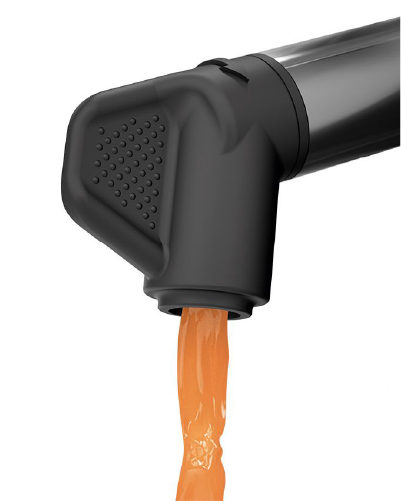 The Zumex Multifruit non-drip rotating tap pouring fresh carrot juice