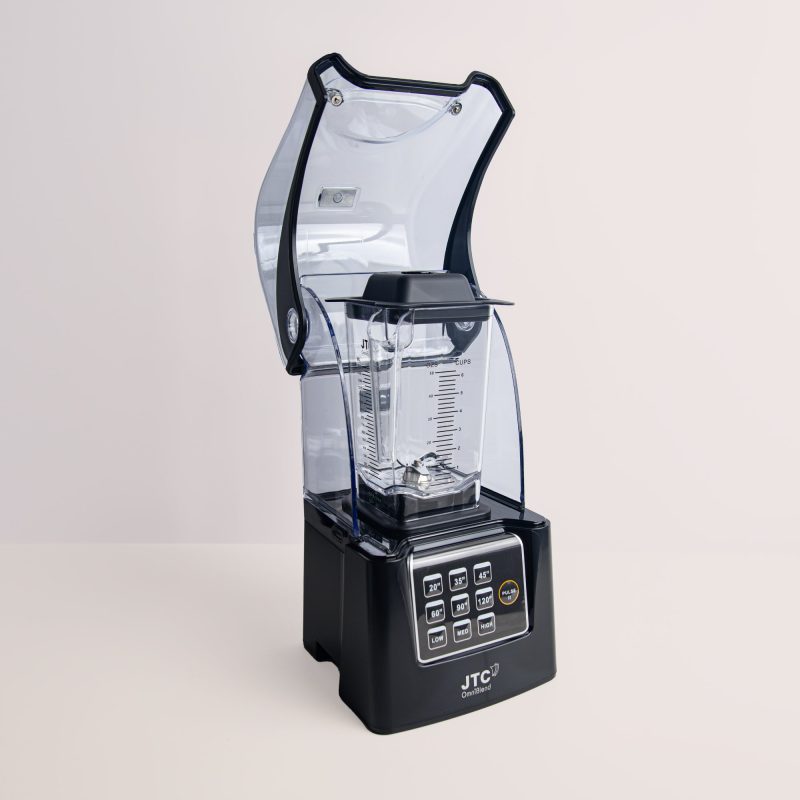 OmniBlend V+ commercial blender with the hinged sound cover open for access to the 1.5L jug