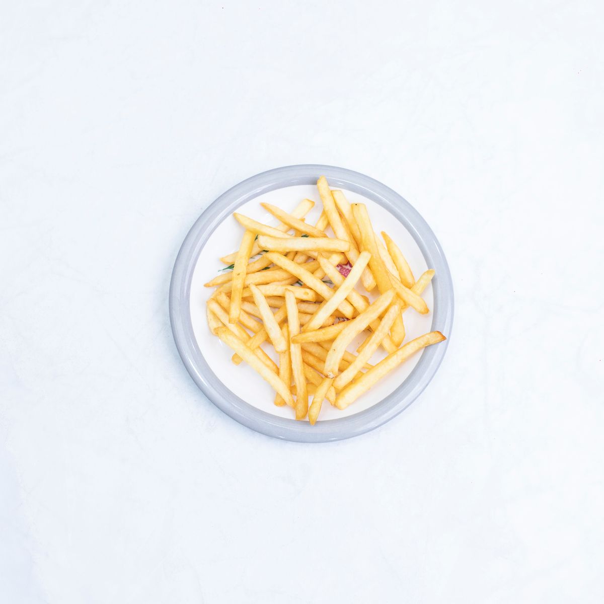 Crispy golden chips on a white plate