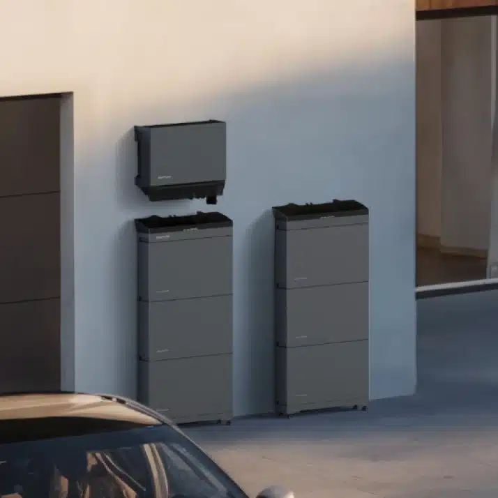EcoFlow PowerOcean Plus three-phase system on the outside wall of a modern house