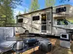 EcoFlow DELTA 3 Ultra Plus at a campsite with a motorhome