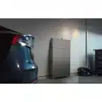 EcoFlow PowerOcean Single-Phase floor-standing system in a home garage beside a car