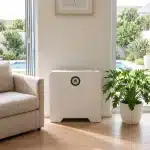 Huawei Power-M 5kWh in a bright living room with sliding doors to a garden and pool
